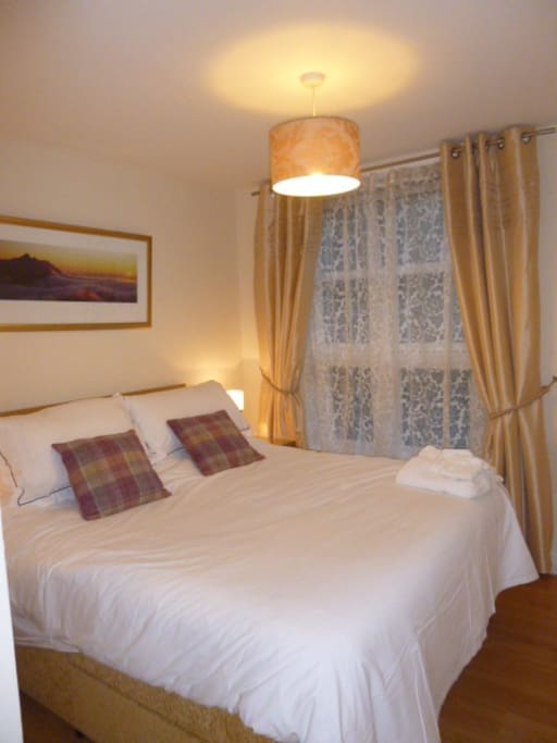 Master bedroom, large, comfortable bed and en-suite shower room off