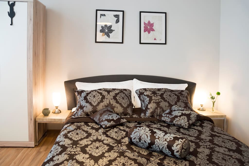 Living room with king-size bed for two person.