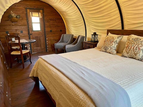 Elegant covered wagon glamping experience