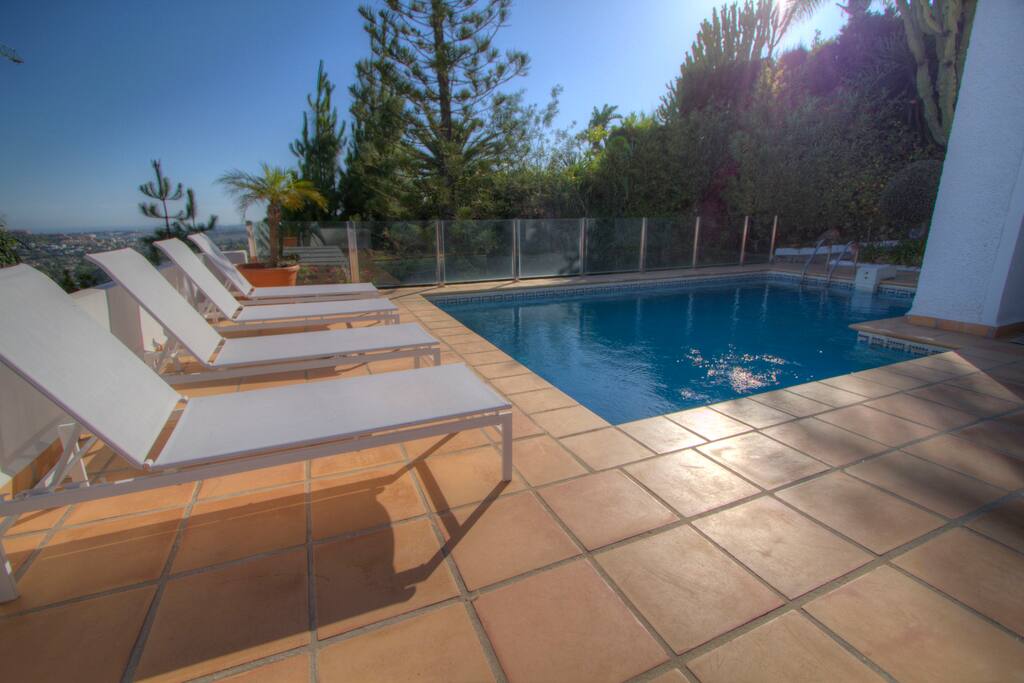 Beautiful private pool with panoramic sea views and sun loungers