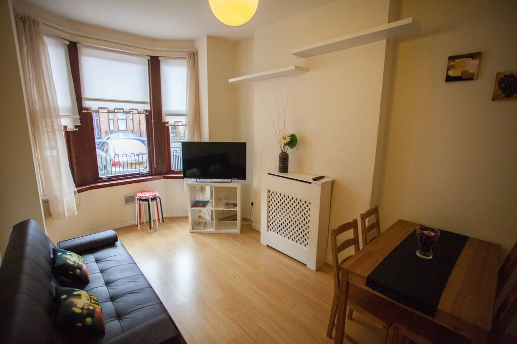 Living space with dining set & cosy couch