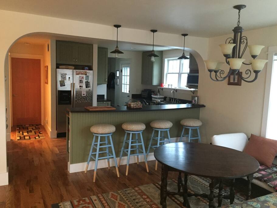Open kitchen with breakfast bar, fully stocked for cooking meals and entertaining
