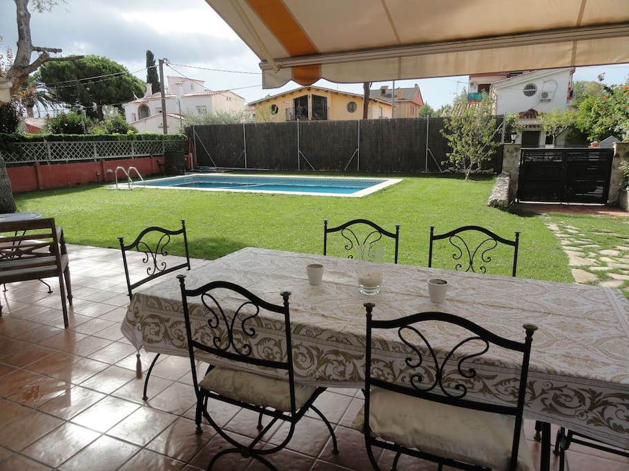 view of private garden and pool from lounge