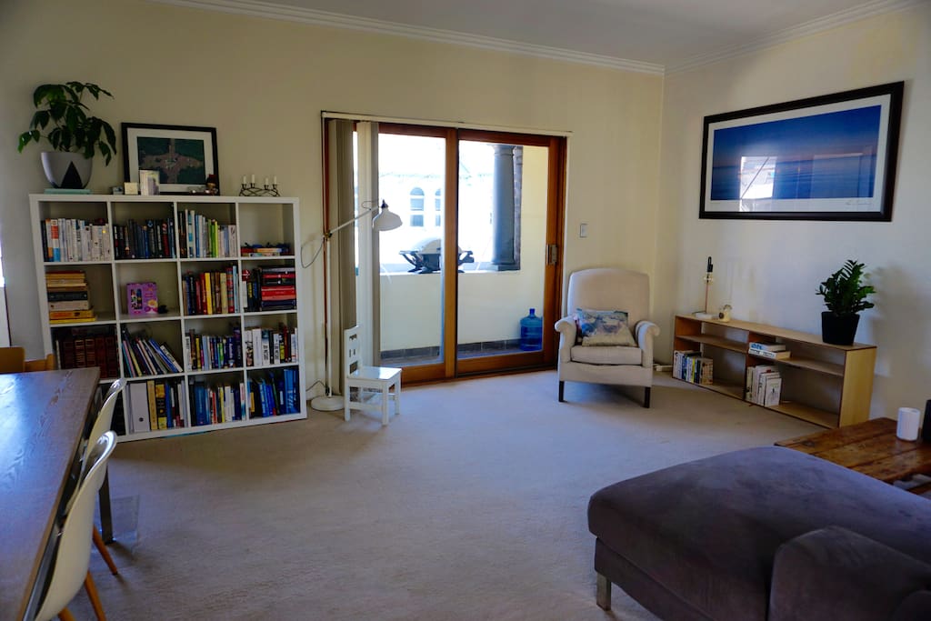 Living area with lots of natural light from private balcony.