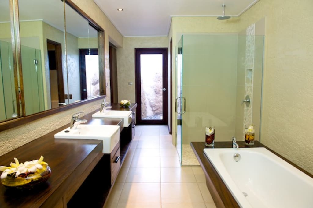 Large bathrooms with indoor and outdoor showers