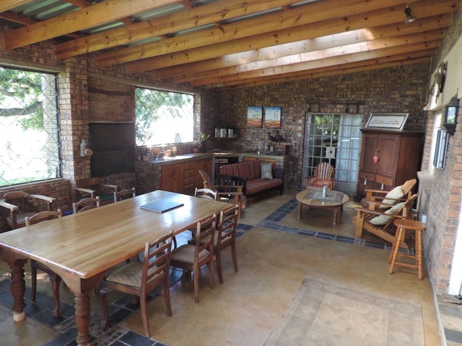 Spacious stoep where guests can relax, read or watch TV