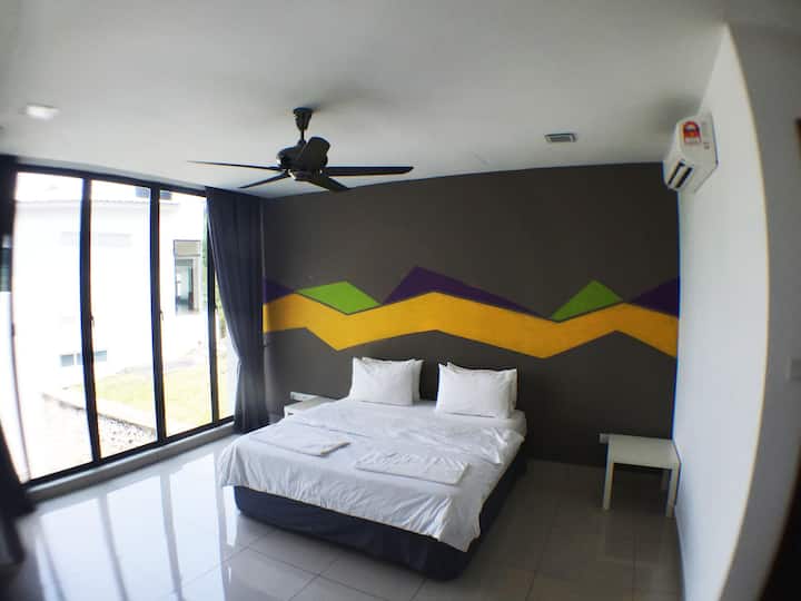Pool deck bedroom with a king size bed ( lower level 1) suitable for couples with one or two kids .