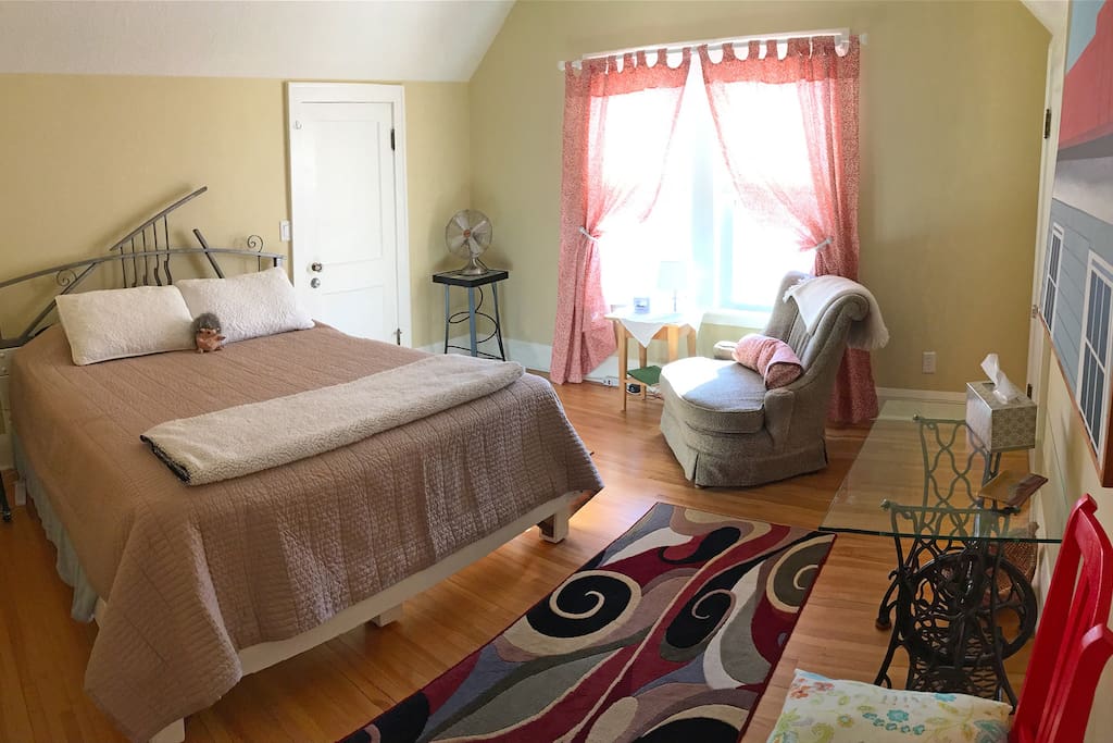 The cozy east bedroom has a queen bed with a walk-in closet.