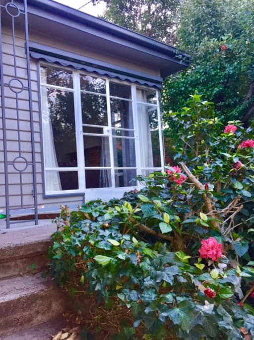 The Mid Century styling offers you a spacious front patio with its big French Doors.