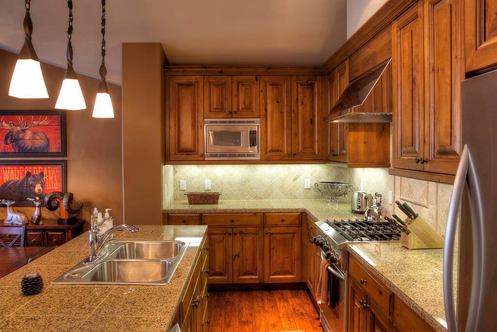 The professionally outfitted kitchen with solid granite countertops