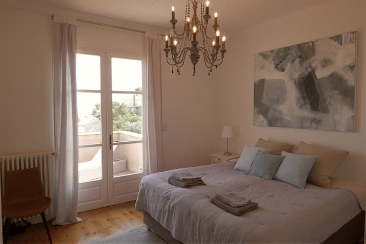 Top floor: Master bedroom with double door to the large balcony.