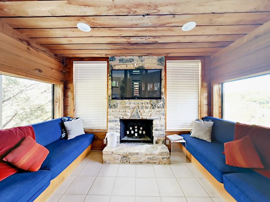 Watch a movie on the 55" TV in the living room. (Please note the fireplace is not operational.)