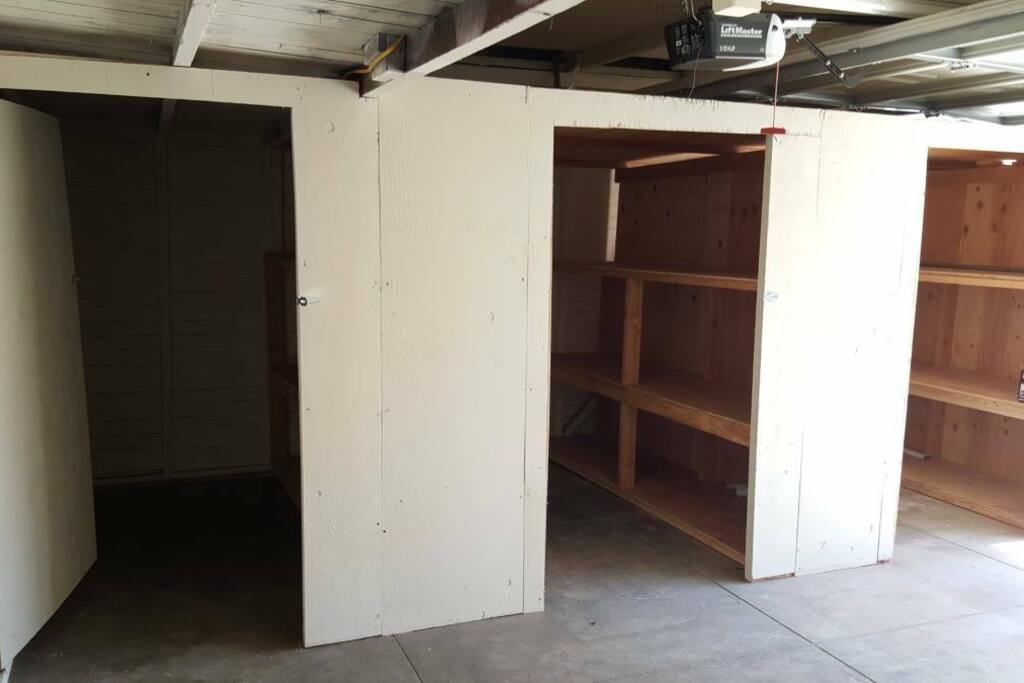 The shared space. Right side of the garage: Space can hold a queen mattress + storage shelves. Outlets and lighting are available