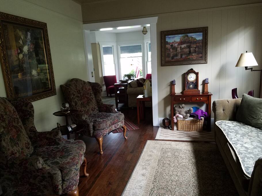 Relax in the sitting room with a cup of coffee and a good book from our library.