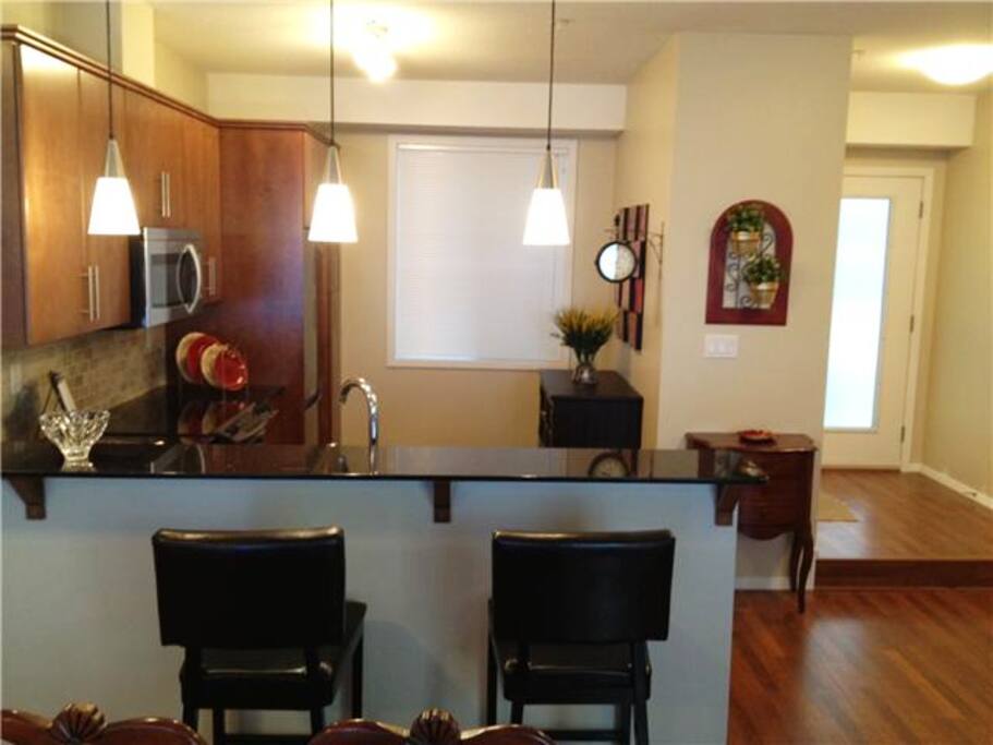 Kitchen with Entrance way on the right. Front closet provided