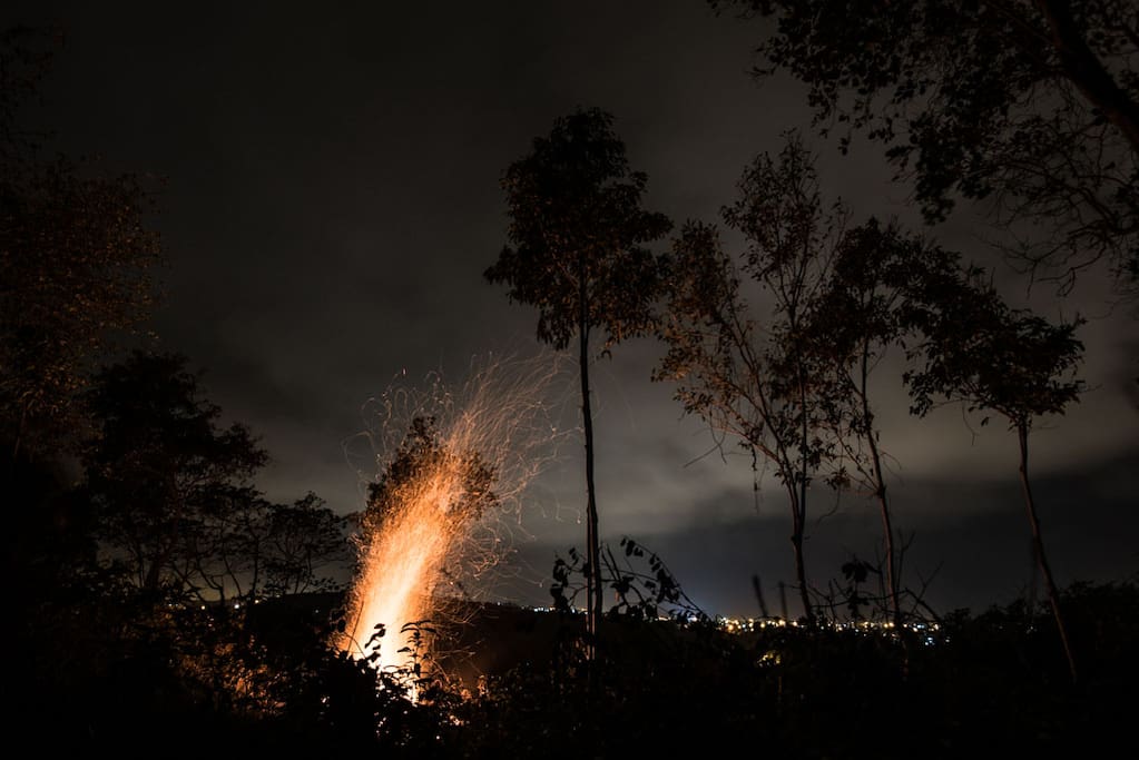 A Night fire by the hillside.