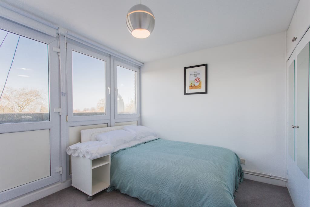 Bedroom 1, with a double bed complete with its own mini-balcony