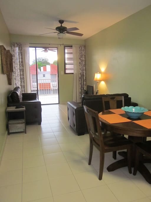 Looking from kitchen, to dining area, living room, to terrace
