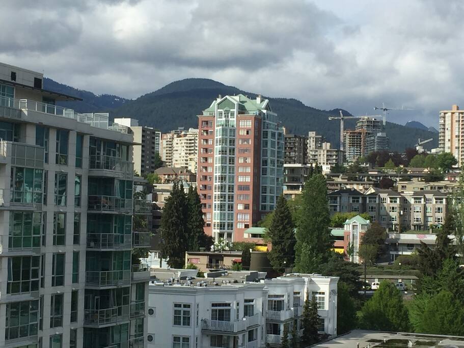 Views to the city of North Vancouver and the coastal mountains form your suite