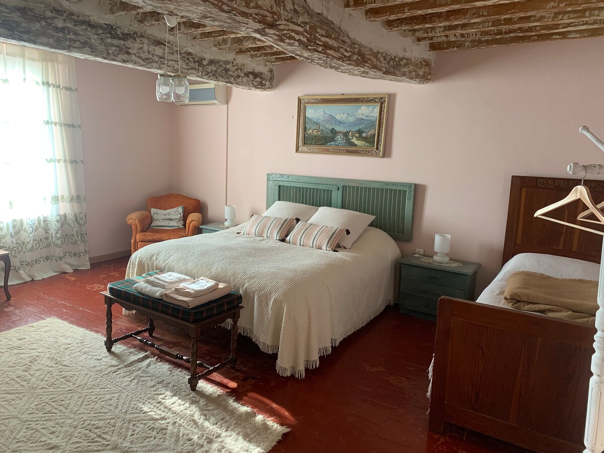 Master bedroom, up to 4 beds, private bathroom with access from next door, on a private hallway. Beautiful view of the surrounding countryside 