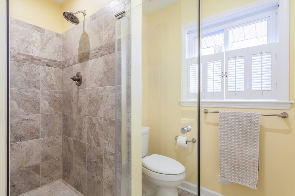 New tile shower in large bathroom