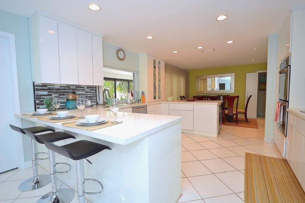 Spacious Open Kitchen (Fully Equipped) Features Quartz Counters (Barstool Dining) + Pool Lounge Views + Access...