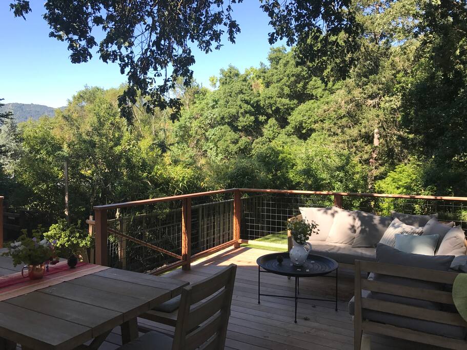 The back deck overlooking the private lawn and shared garden
