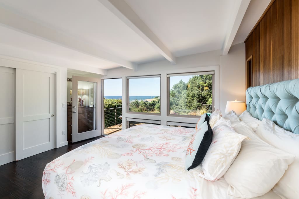 Master bedroom (king bed) with picture windows and direct access to the deck. Awaken to stunning ocean views!