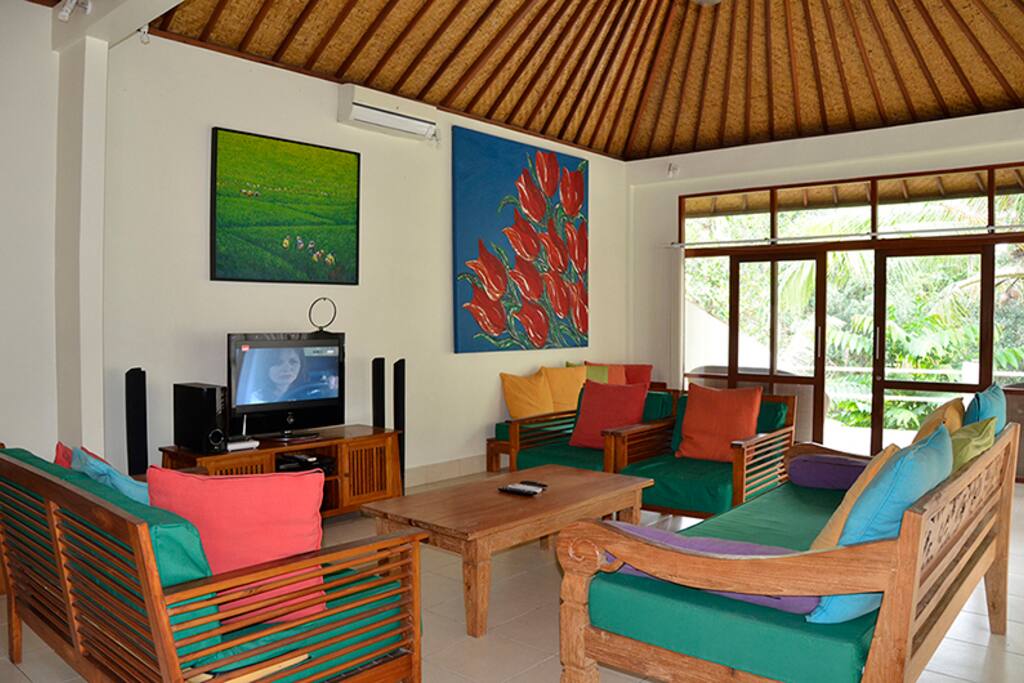 The living room is huge and well furnished.