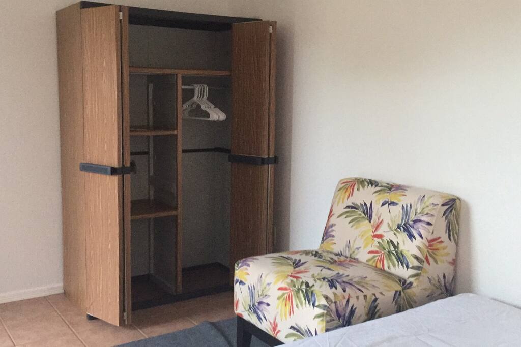A closet for your clothes and a place to sit.