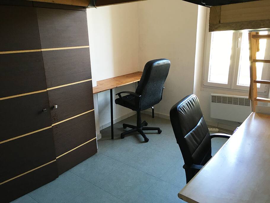 Room below the mezzanine with 2 desks and chairs