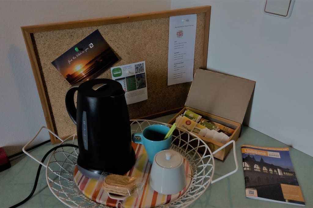 There is a kettle and selection of teas and coffee in the room.