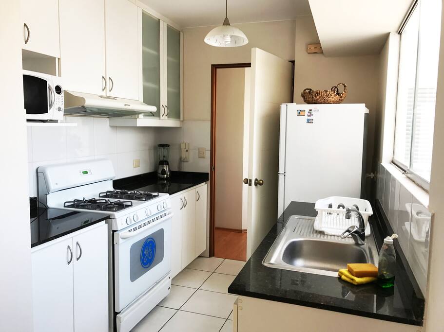 Kitchen filled with any supplies you may need to create a delicious meal.
