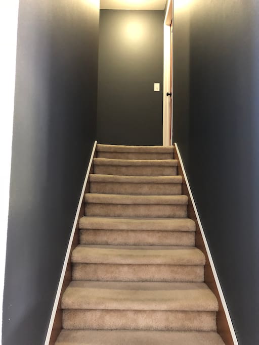 The hallway leading up the stairs. Your room in on the right at the top