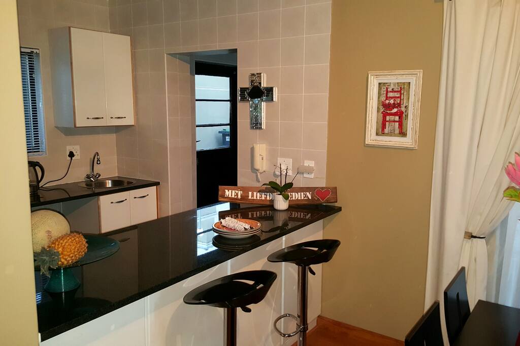 Kitchen with scullery and breakfast counter.