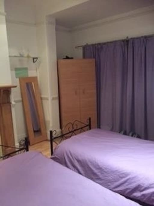 Double Bedroom with two single beds, wardrobe (hangers), desk space for laptop