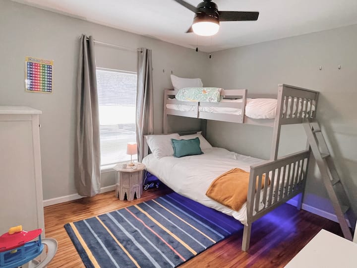Kids bunk bed room with toys and games