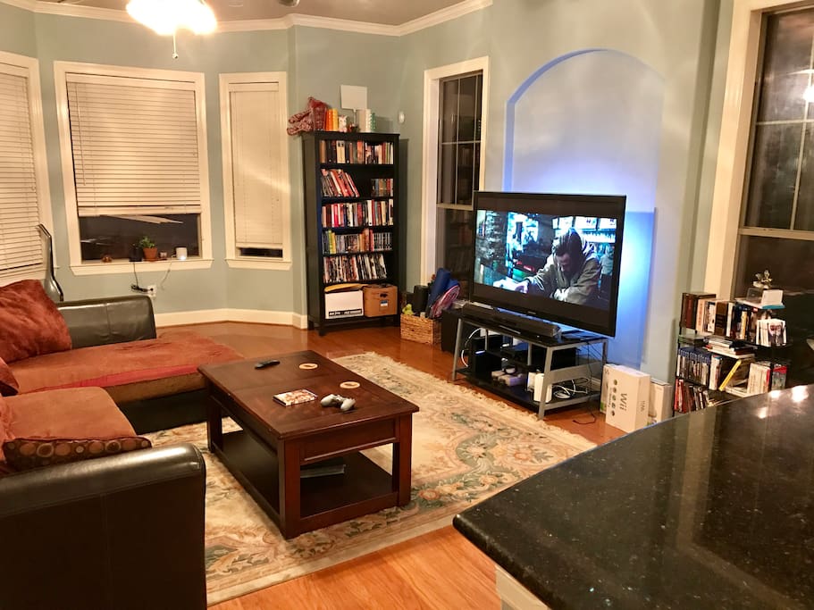 Living room with big screen and large couch