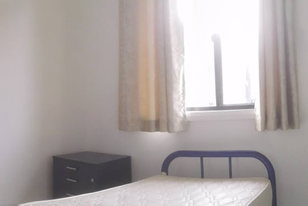 Single room (ensuite) with build-in, desk, bed and bedside