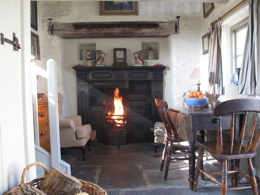 Poppy sitting room with old range and open fire