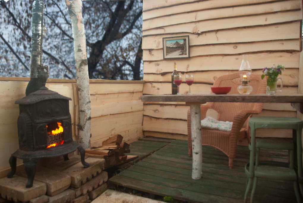 Tiny outdoor shelter attached to shed behind the studio. The shed has room for your gear as well as kindling and firewood for sitting by the little antique stove on a starry night.
