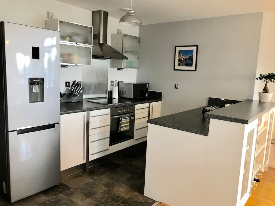 Kitchen with hi-tech Samsung fridge freezer with fresh water dispenser