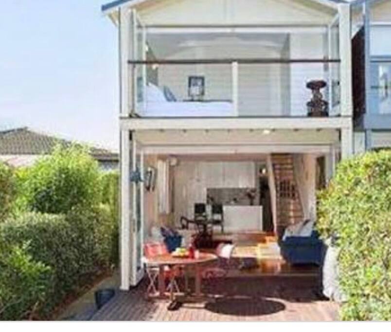 A bbq and seating arrangement in backyard