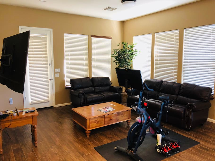 Family room with plenty seating area and large Samsung 4K TV
