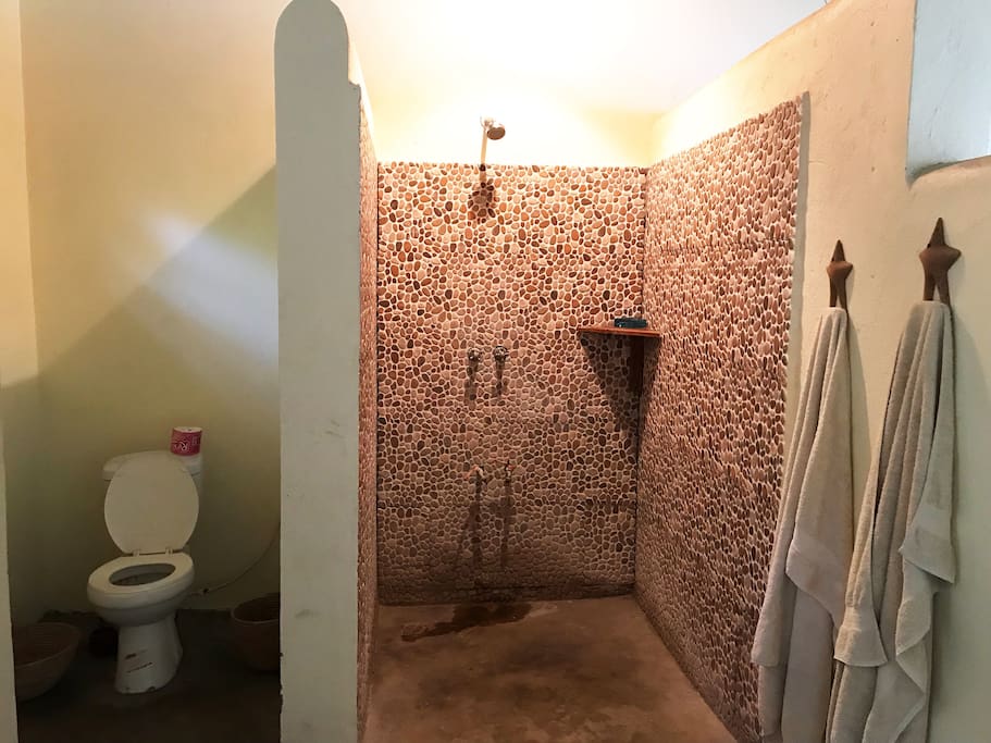 En suite bathroom with a very big hot-water shower