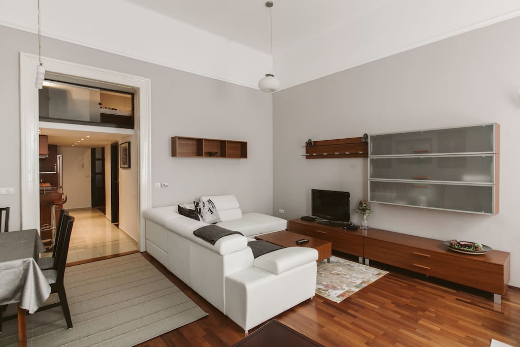 Sunny, spacious and modern living room. The white sofa turns to a comfortable double bed. Fully equipped and furnished in a really good quality.