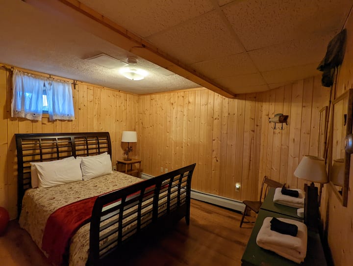 Lower level bedroom with queen bed. 