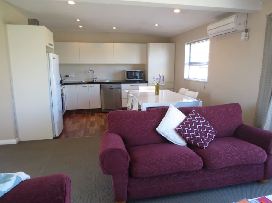 Fully equipped kitchen with modern appliances including dishwasher.