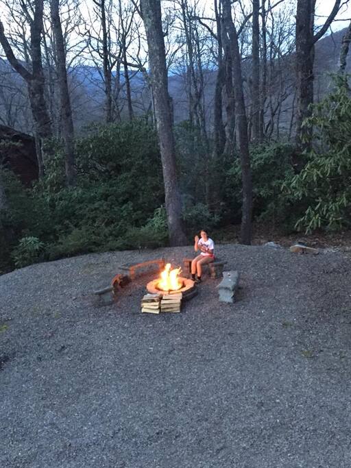 View from the deck overlooking driveway and fire pit. Even in the summer it's time to build a fire!