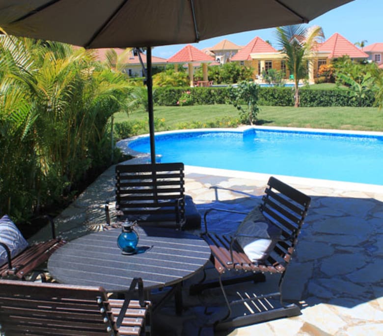 Private swimming pool nestled in a tropical garden